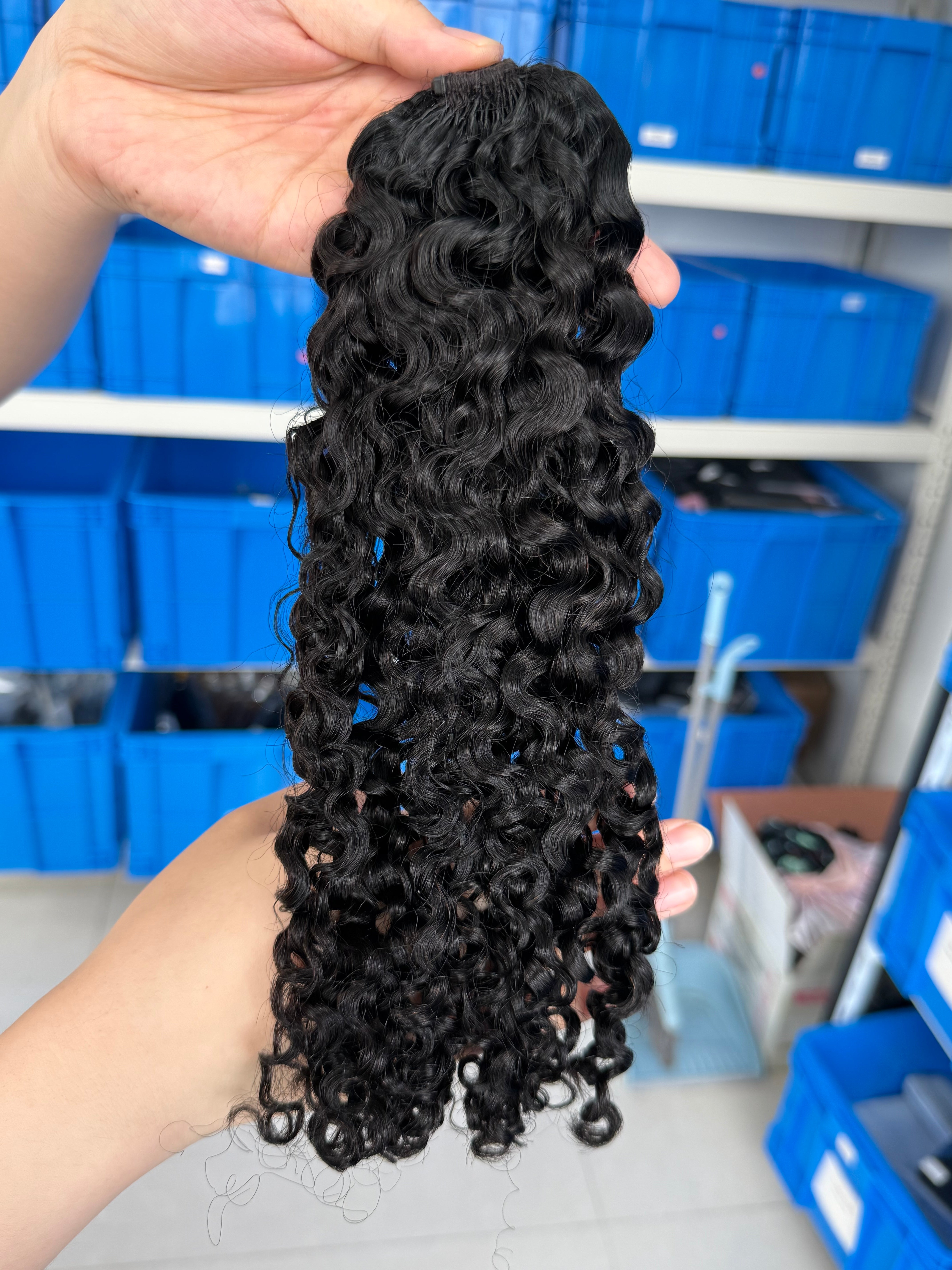 Close-up of knotless pre-separated crochet hair extensions Burmese curly – natural look, quick install, tangle-free